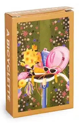 Mini Bicycle -palapeli 99 palaa on ranskalaisen Trevellen minipalapeli. Kuvassa polkupyörä, jonka kotiin on pakattu keväisiä kukkia ja aurinkolasit.