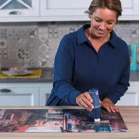 Ravensburger Puzzle Conserver Permanent 200 ml palapeliliima kiinnittää valmiin palapelin pysyvästi.